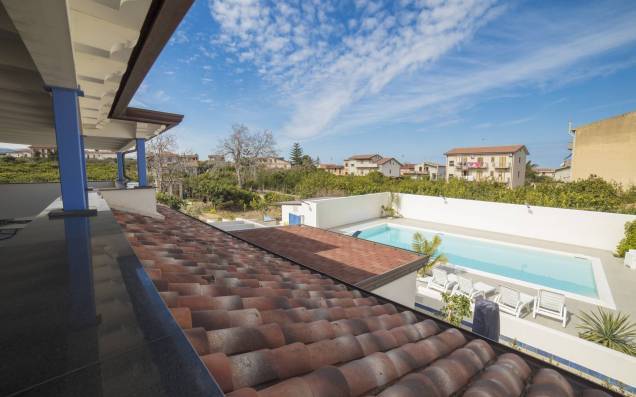 View of the pool from the terrace, garden side