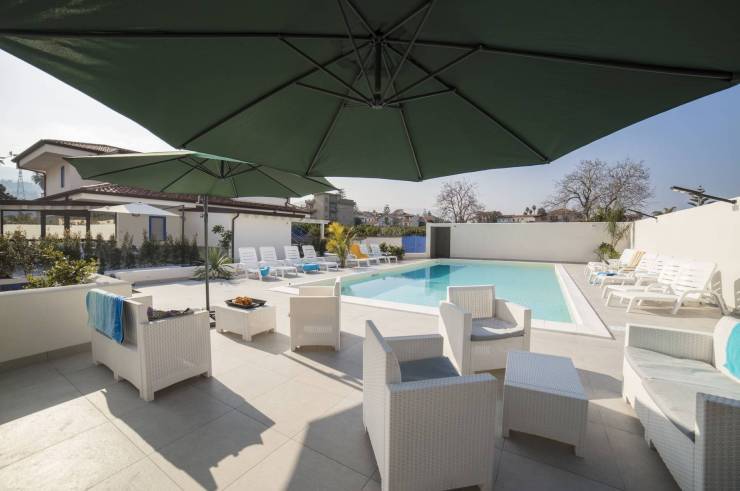 Relaxation area in front of Villa Concettina's swimming pool