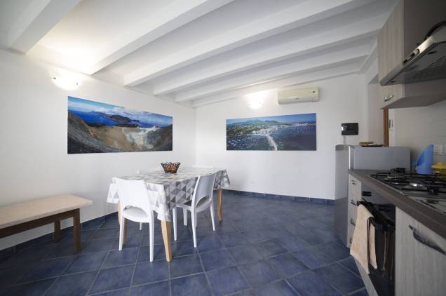 Another view of the spacious living room with kitchen